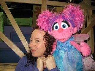 Ilyana Kadushin on the set of Sesame Street television with Abby.