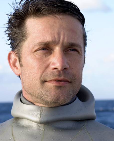 Gazing at the crystal blue waters off the waters of Florida, Fabien prepares to free dive.