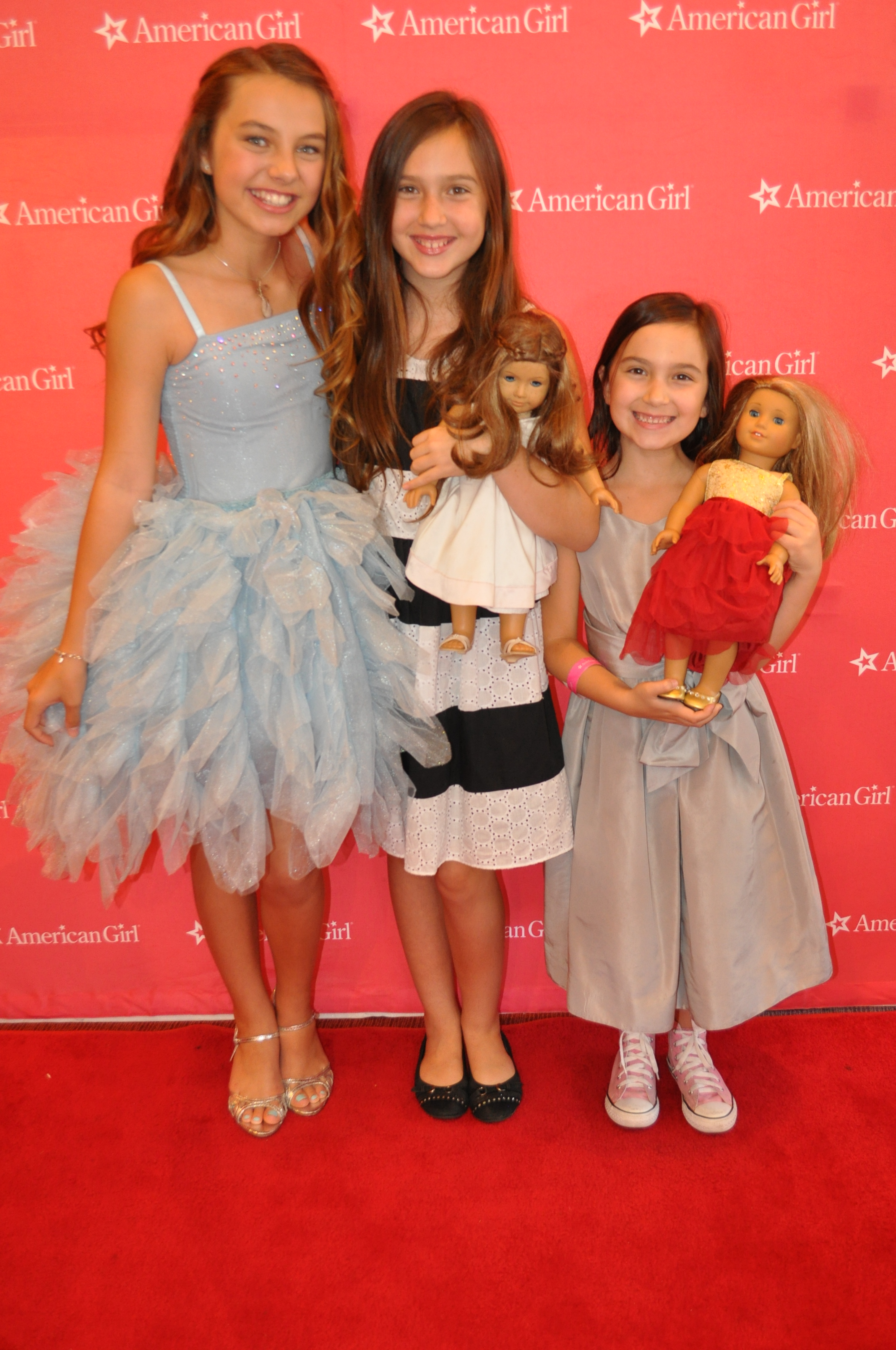 At the American Girl premiere Grace Stirs Up Success with actress Caitlin Carmichael, and sister, actress Bluebelle Saraceno.