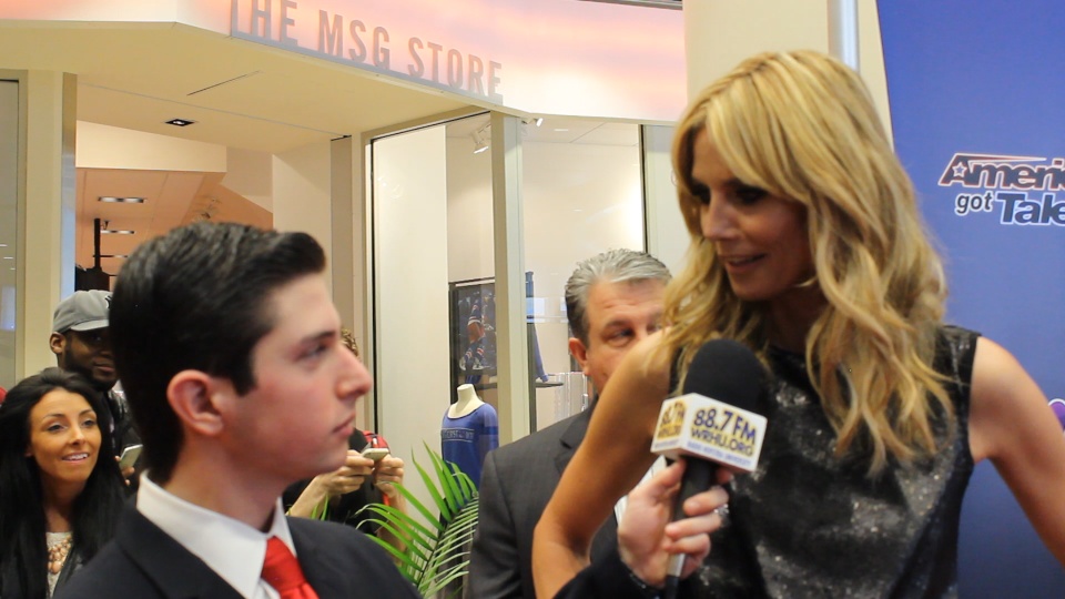 Neil A. Carousso (left) interviews supermodel Heidi Klum on the red carpet