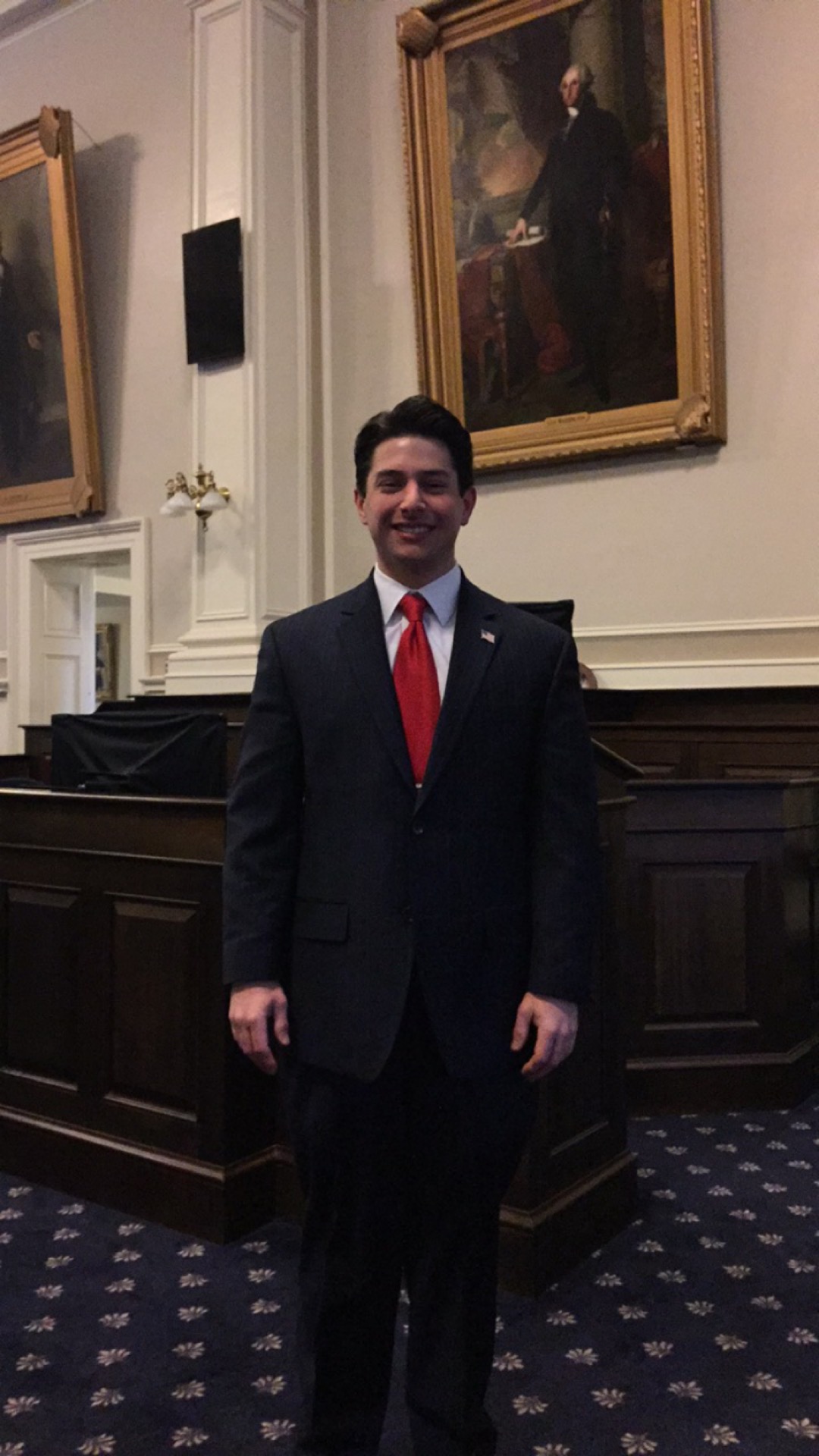 Neil A. Carousso poses in the New Hampshire House Chamber, the largest state House Chamber in the United States.