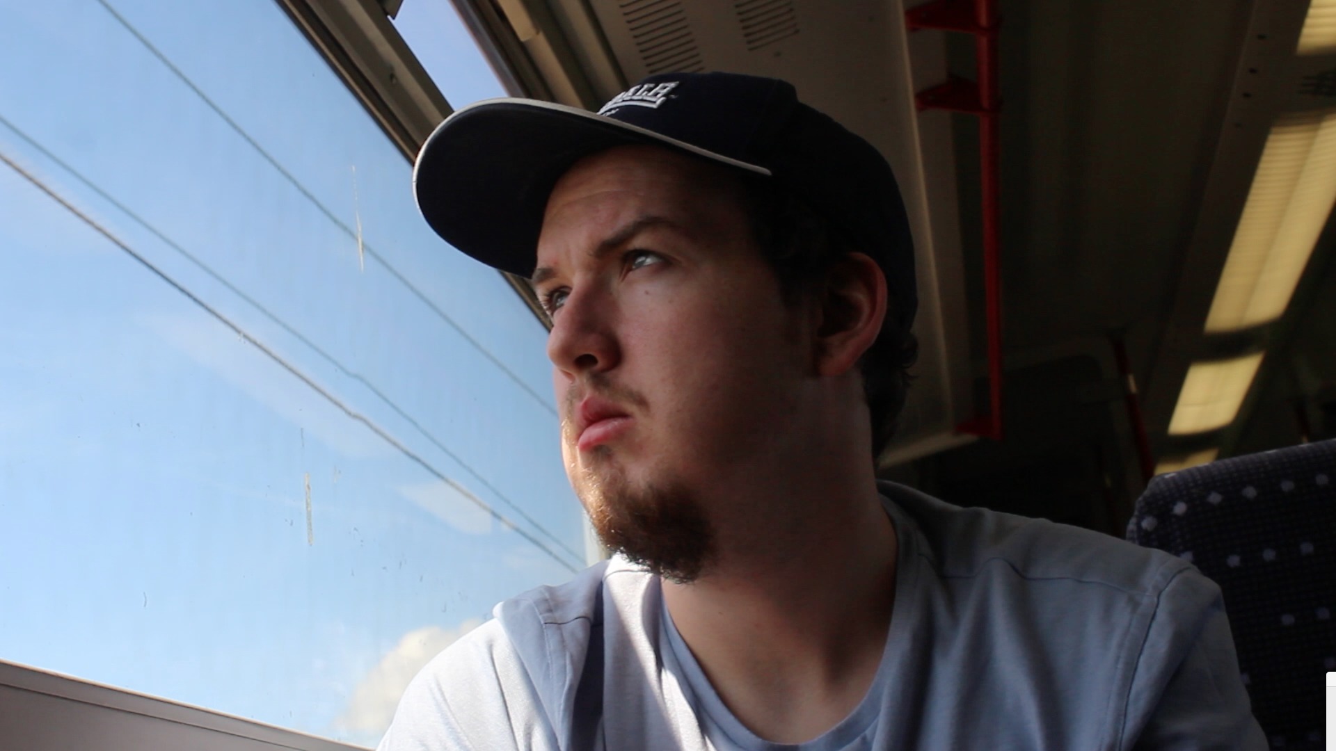 Pensive out of train window.