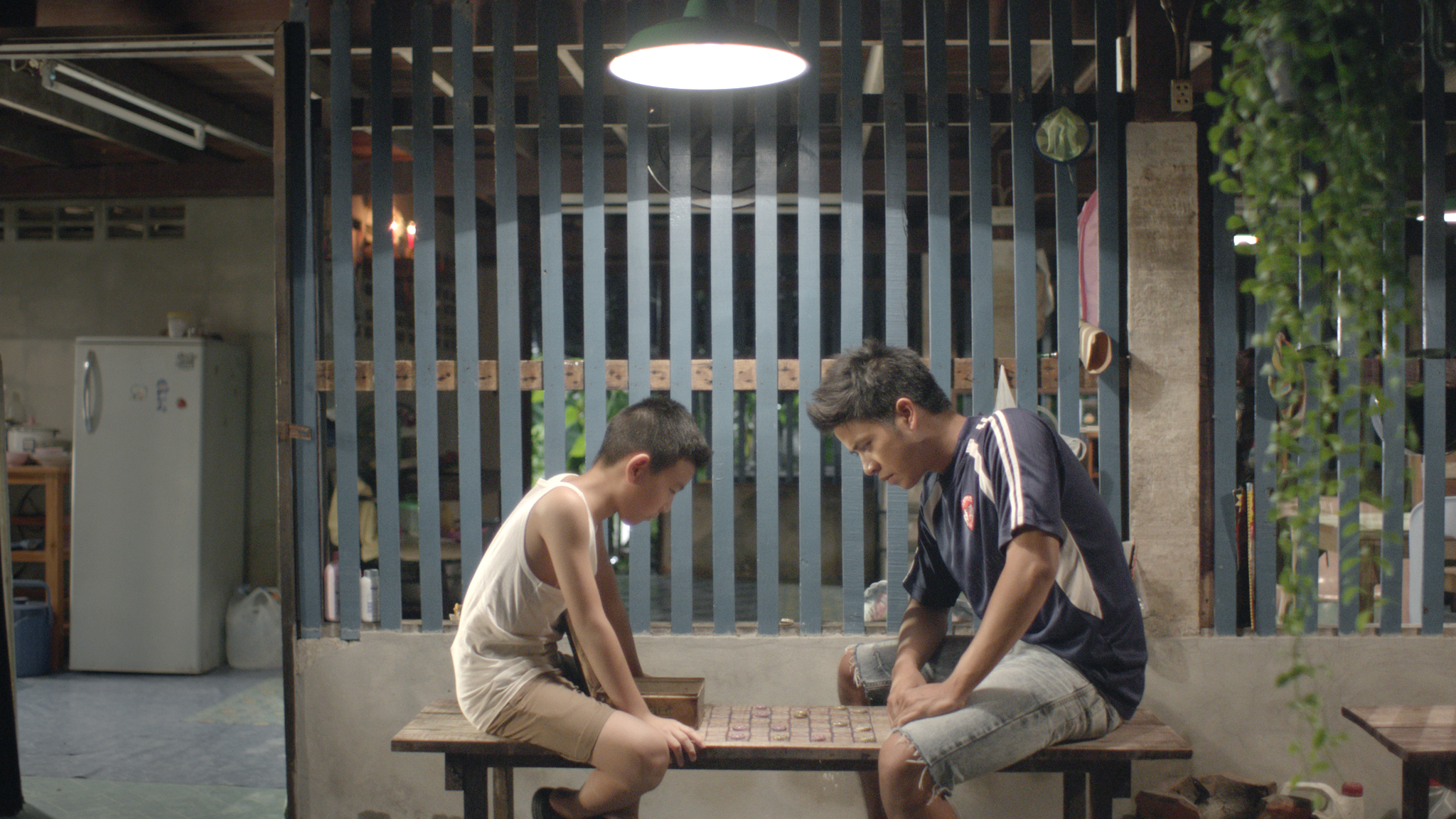 Still of Thira Chutikul and Ingkarat Damrongsakkul in How to Win at Checkers (Every Time) (2015)