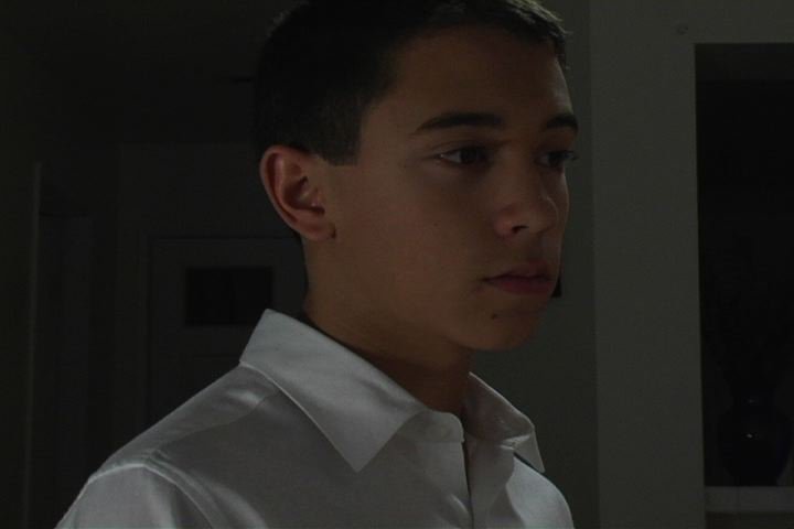 Samuel in character on set as James in 
