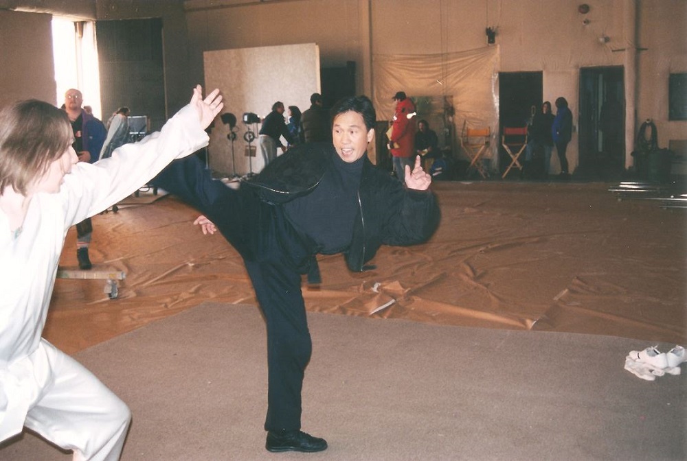 Michael Dawson and Ho Chow rehearse a fight scene on the set of 