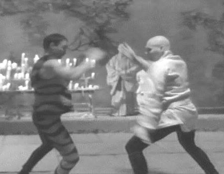 Michael Dawson (right) as a White Crane master battles a master of the Tiger Claw style in 