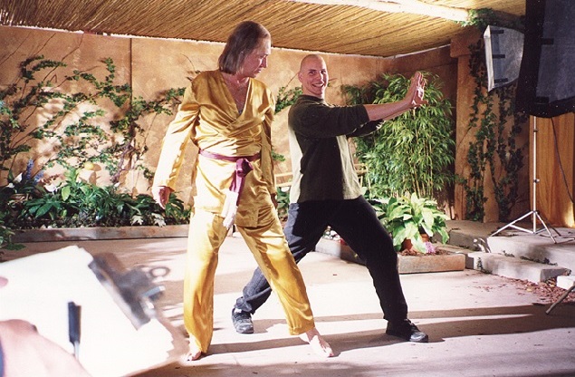 Michael Dawson works with David Carradine on the set of 
