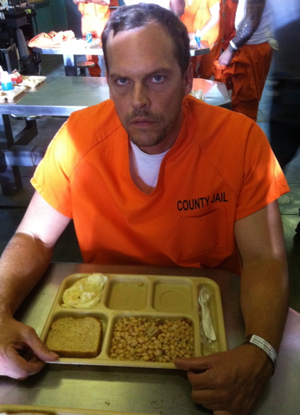 Josh Harp as Prisoner