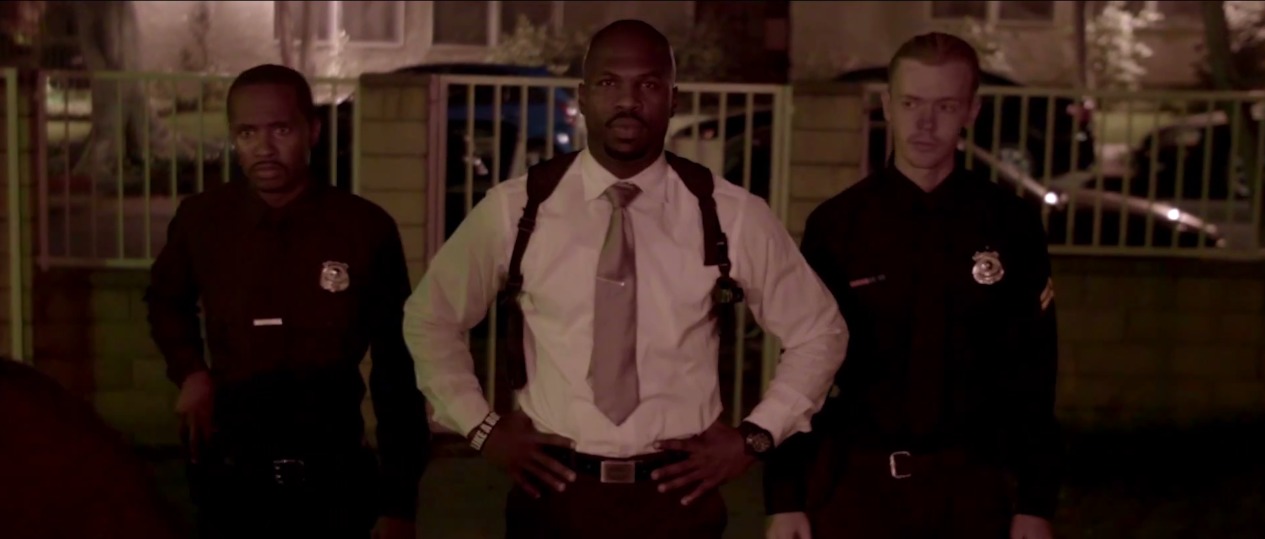 Jacob (on the far right) playing a police officer in the movie 
