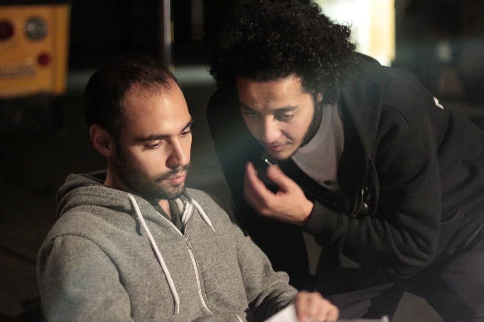 Mohamed Youssef while discussing the shooting schedule with his 1st assistant director on one of the shoots