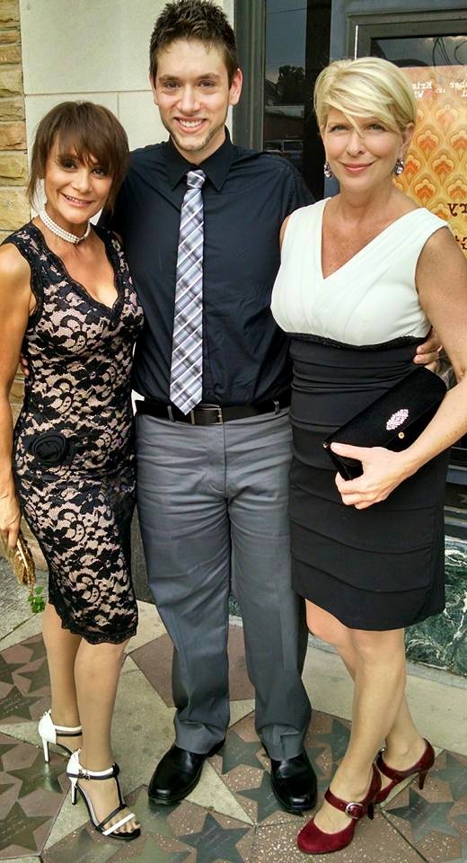 Brandon Seth Chinault (center) with fellow film stars Irene Santiago (left) and Rebecca Rogers (right) at the premiere of Badge of Faith (2015).