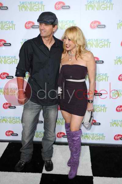 actor Michael Biehn and actress Jennifer Blanc of The Victim arrive at the Take Me Home Tonight premiere on march 3 2011