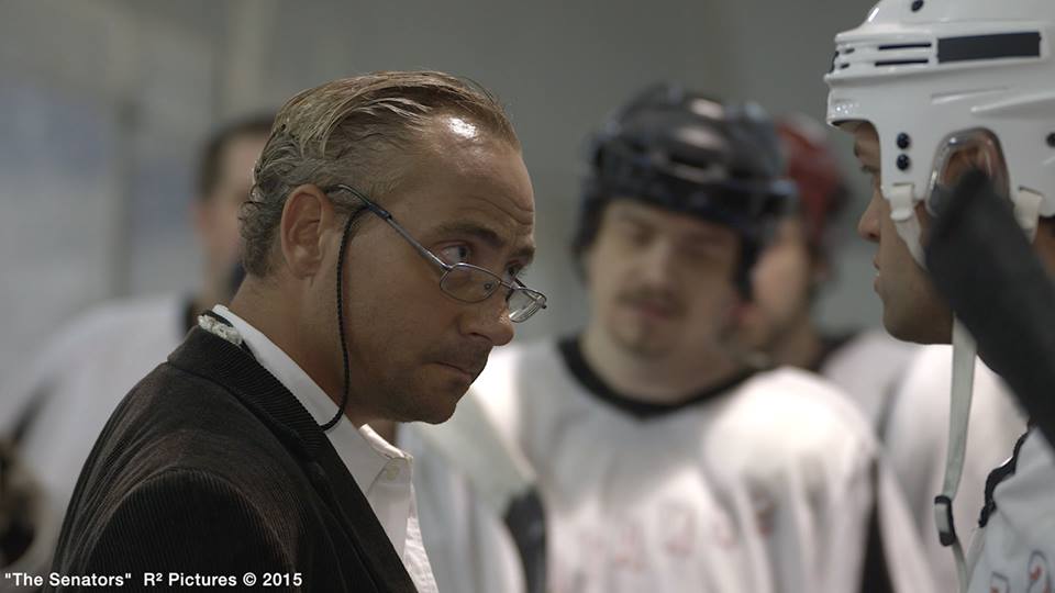 Screen shot from The Senators Movie, as the older Coach Ken (also played younger Coach Ken)