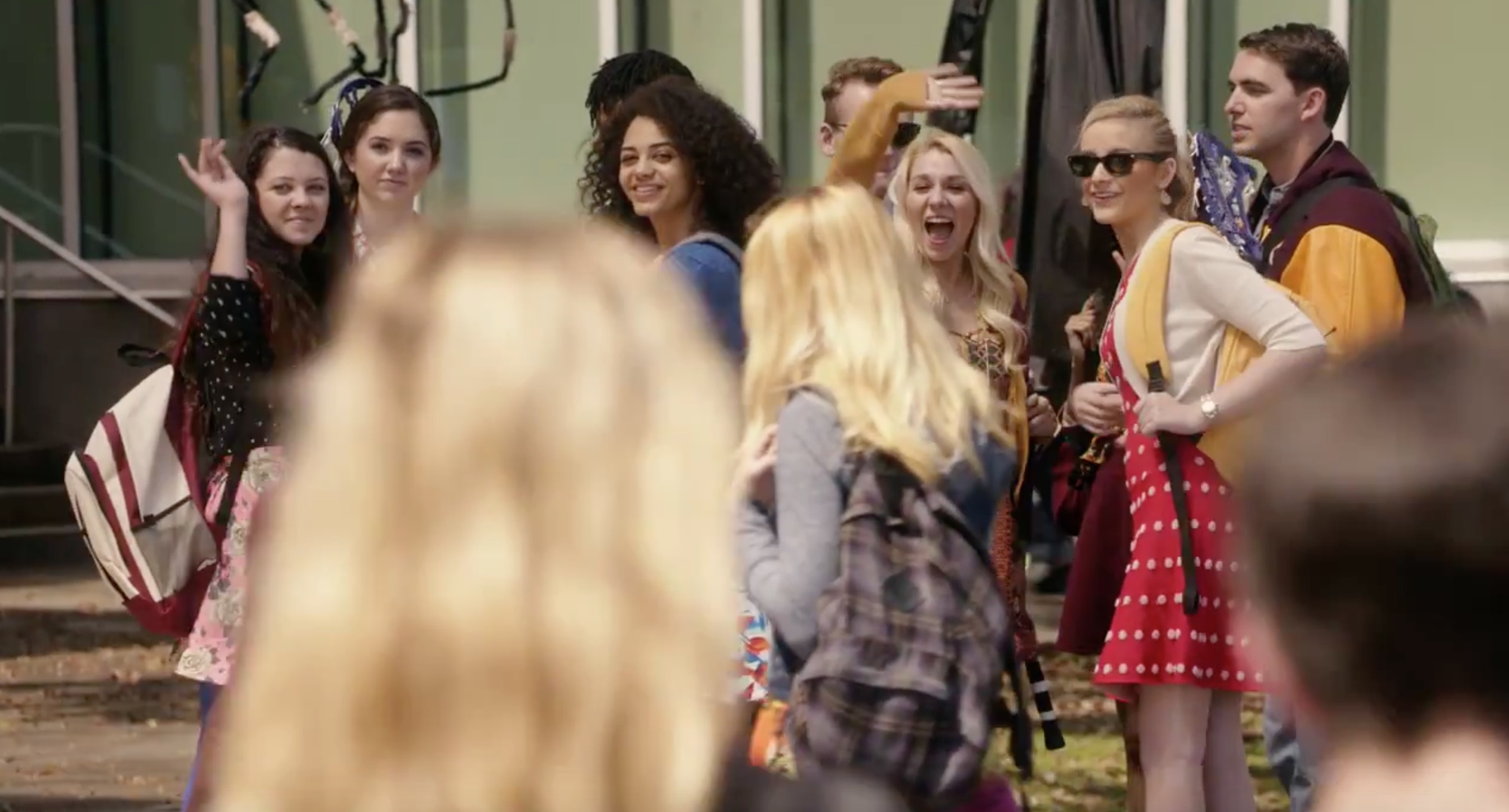 Tiffany Forest is seen here in a red dress in the trailer for the new Disney Channel original movie Invisible Sister