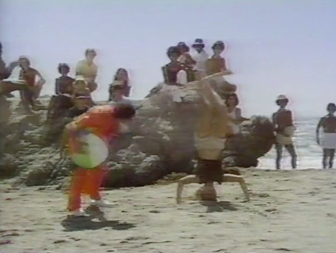Frankie Avalon watches as Kija hula hoops in 