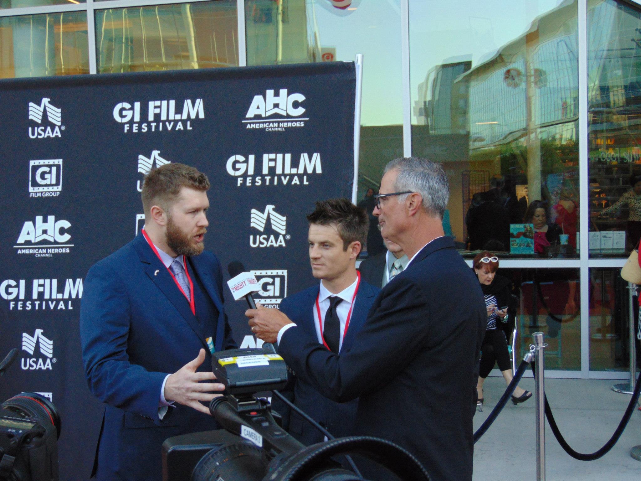Marty Skovlund Jr. and Director Matthew R. Sanders being interviewed on the red carpet at the 2015 GI Film Festival in Washington, D.C.