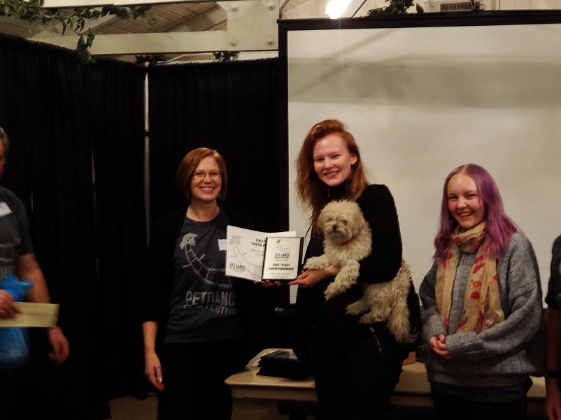 Fiona Hodgson accepting the 1st place, youth produced category, award for Meow The Itinerary. Accompanied by the films DP, Cat Schultz and Fiona's dog, Bandit.