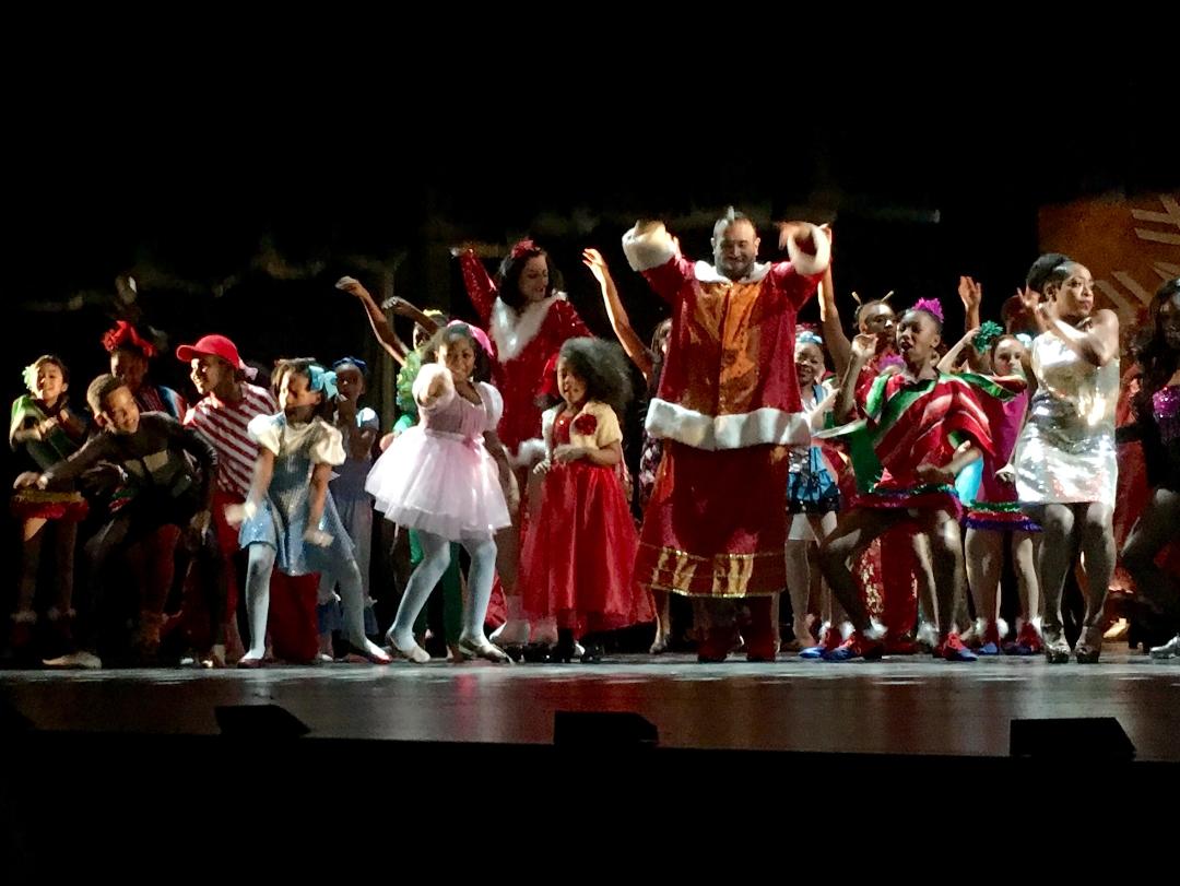 Debbie Allen's Hot Chocolate Nutcracker at the Dorothy Chandler Pavilion December 2015. Jessica light pink pointing at audience. Tichina Arnold silver dress