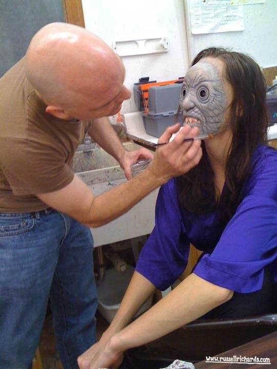 Applying prosthetic makeup on an actress in preparation for an underwater shoot on 