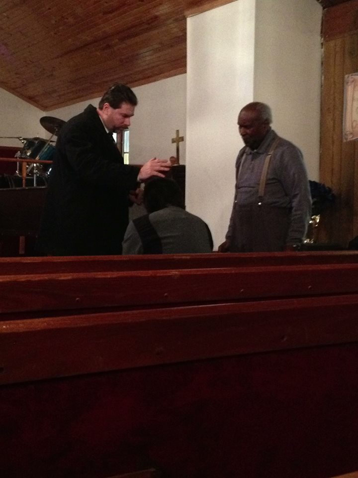 Performing an Exorcism at Memorial Deliverance Temple Long Island, NY. 2014........