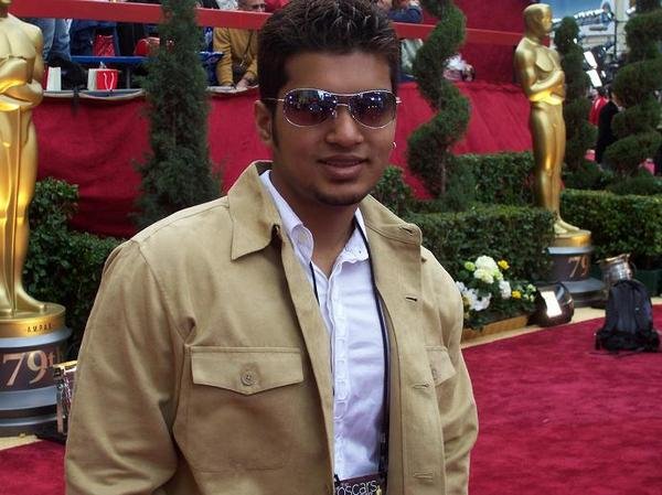 Asif Akbar on the Red Carpet at the 79th Academy Awards.