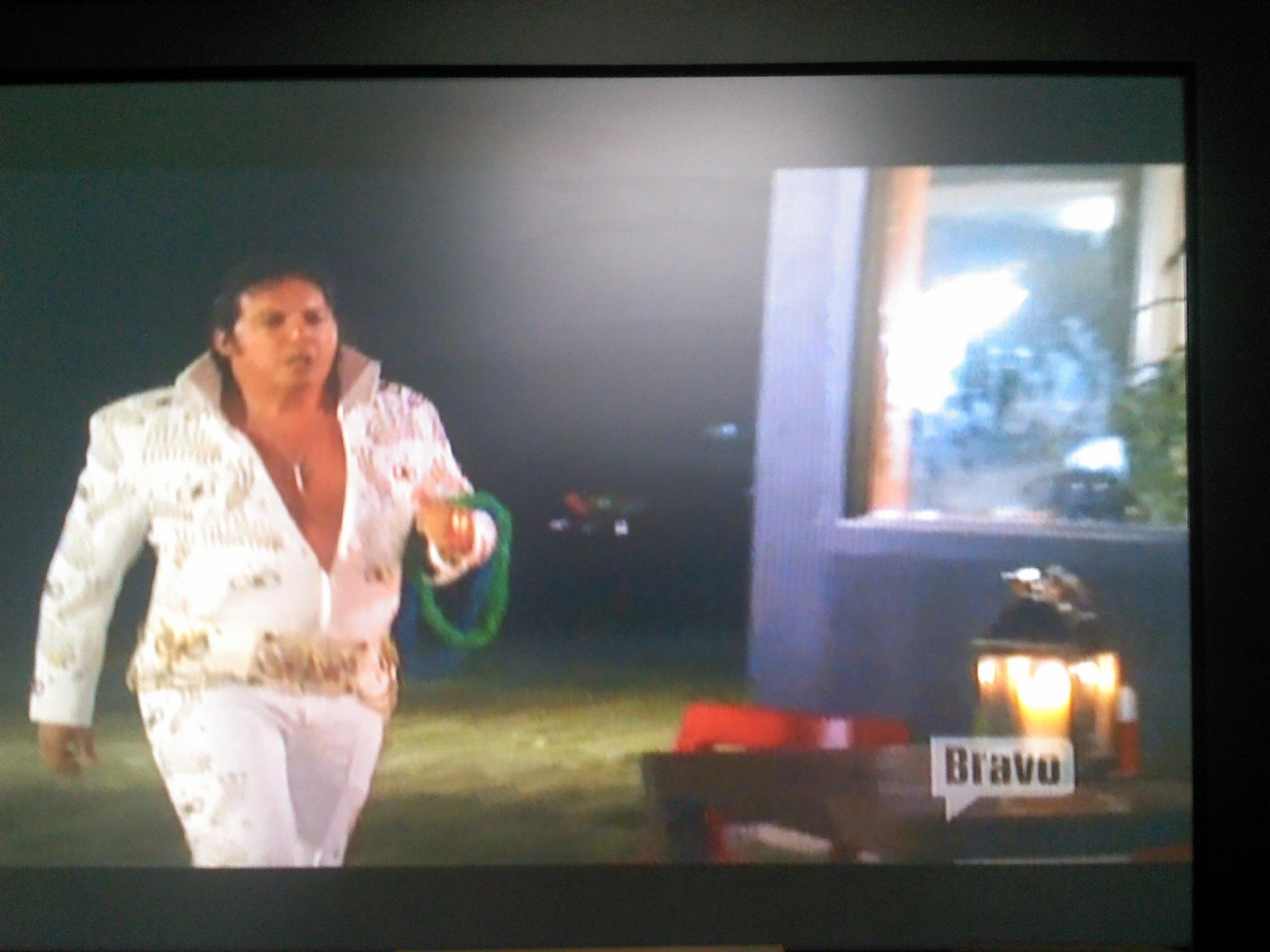 Dean Ciallella as Elvis, entering the outdoor dining area on the set of Bravo Television's Real Housewives of New York City.