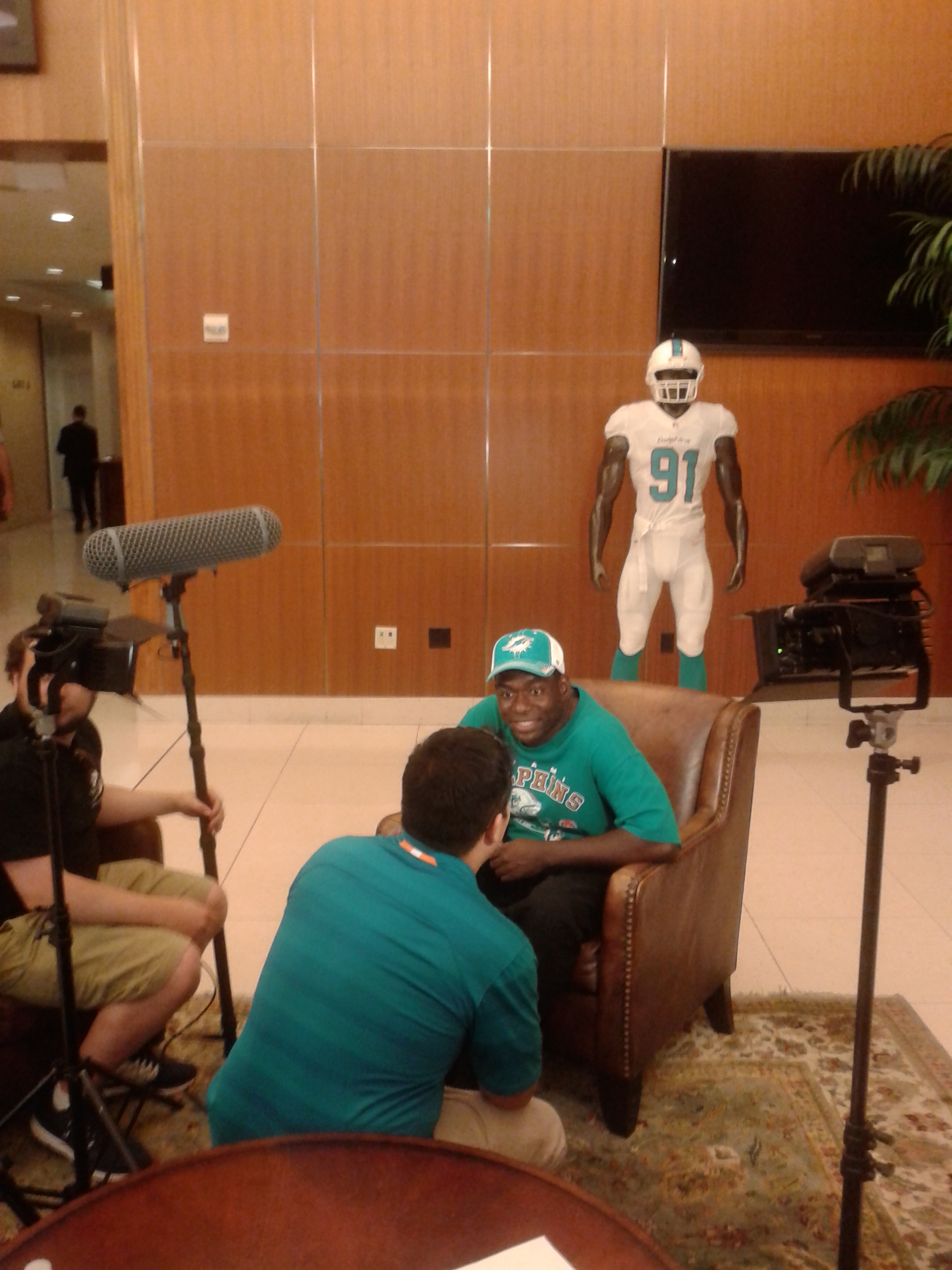 Actor Milton James Jones doing a live interview for the NFL Miami Dolphins network as to when did he really become a Dolphins fan.