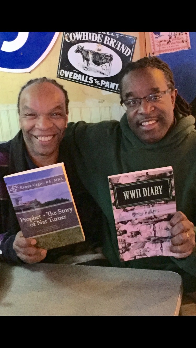 My partner Mack Williams displays his book WWII Diary.