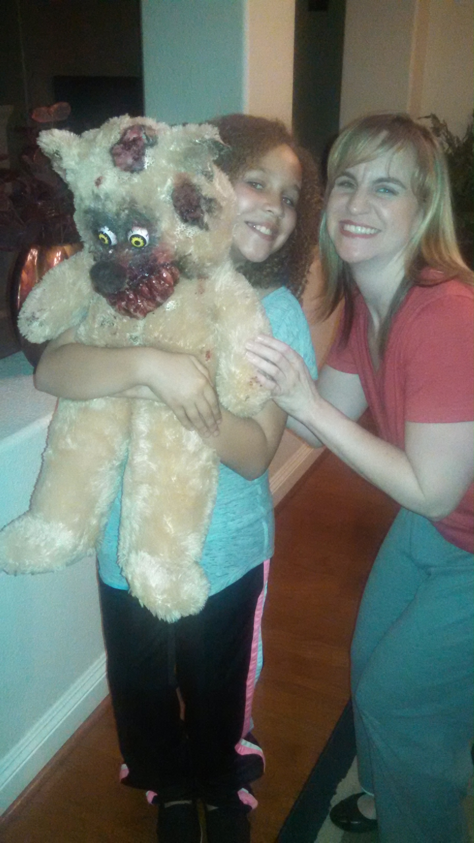 Tiana with actress Amanda Goldrick and the monster teddy bear.