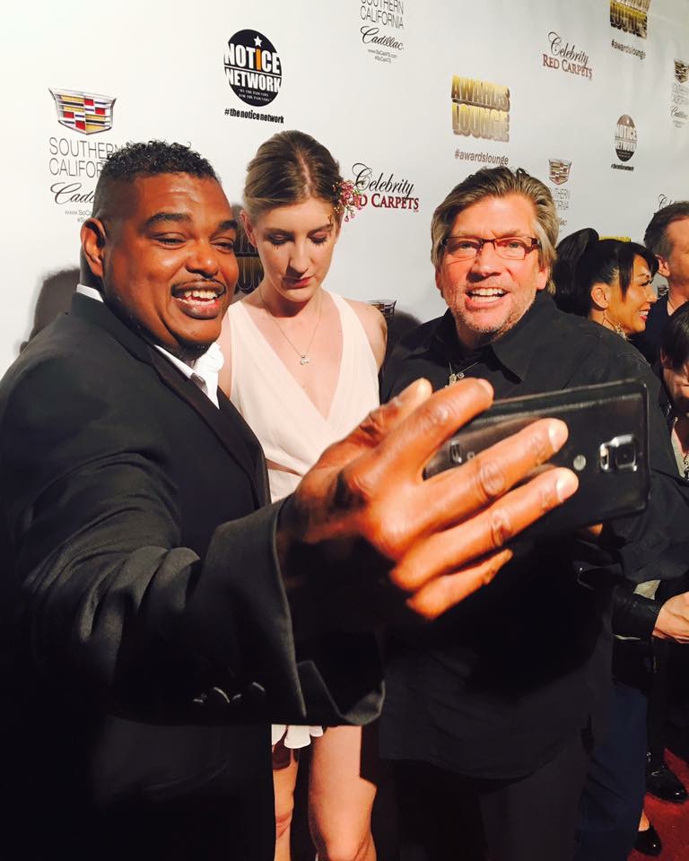 Oscar award winner Sydney Colston takes a selfie with Singer/songwriter and CEO/Founder of Forgotten Anthem Records Audrey Hendricks on the red carpet of the 58th Annual Grammy Awards