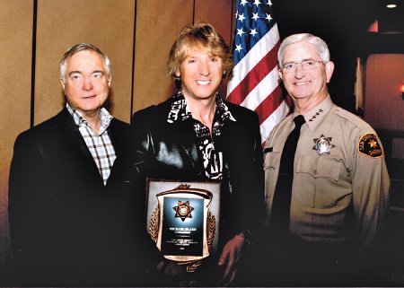 Left to Right, Mike Nesbit (President HDSA), Michael Blakey, William D. Gore (Sheriff of San Diego County). Michael is being honored by the San Diego Sheriff Department and receiving his Honorary Sheriff badge and credentials.