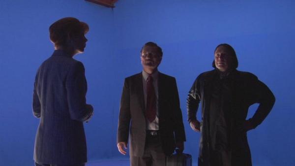 On the right, against blue screen, shooting the never-released film 