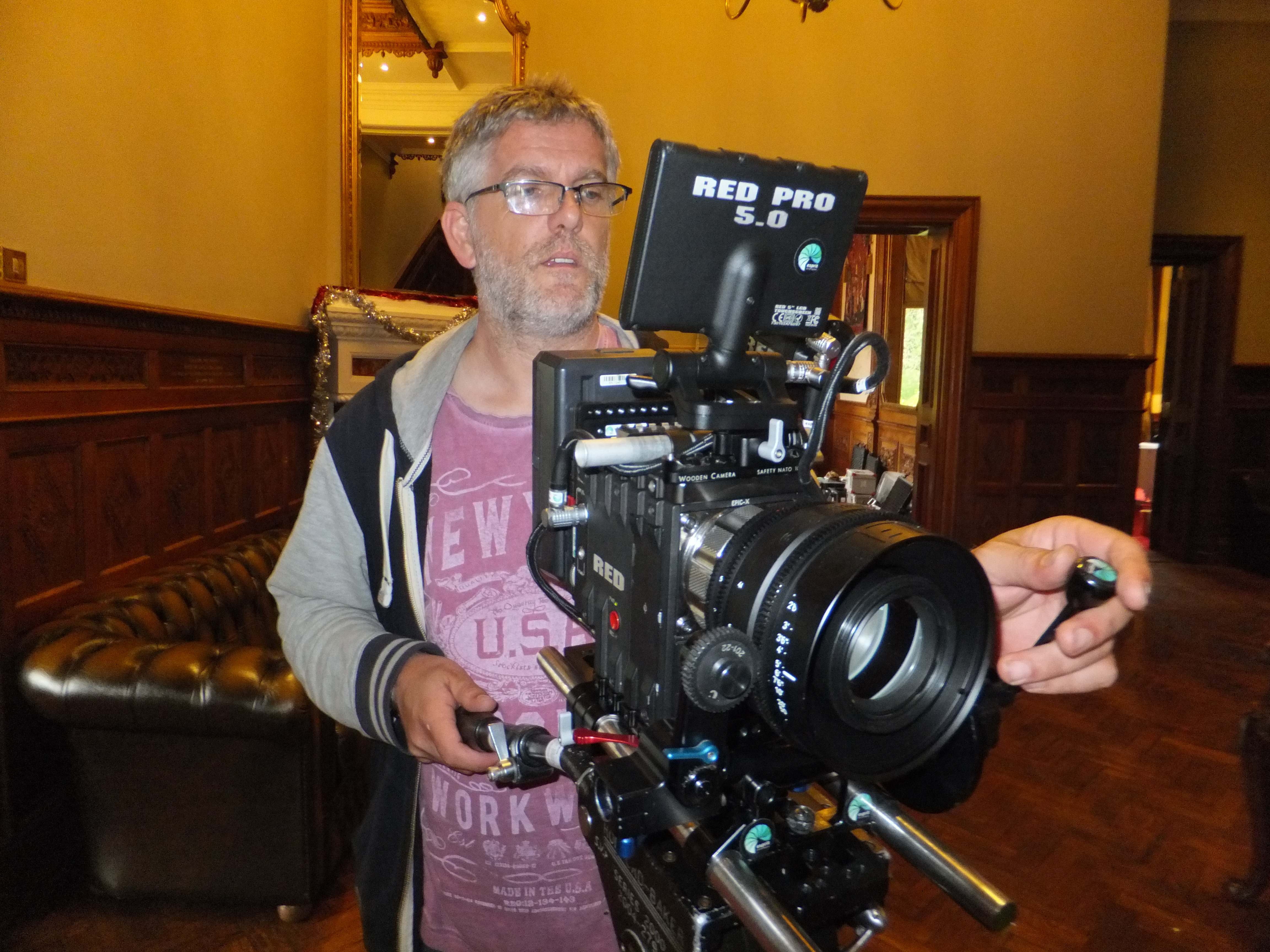 Director Simon J Miller lines up a shot during the filming of the IN YOUR ARMS video recording of Eleanor Grant's song at Manor by the Lake.