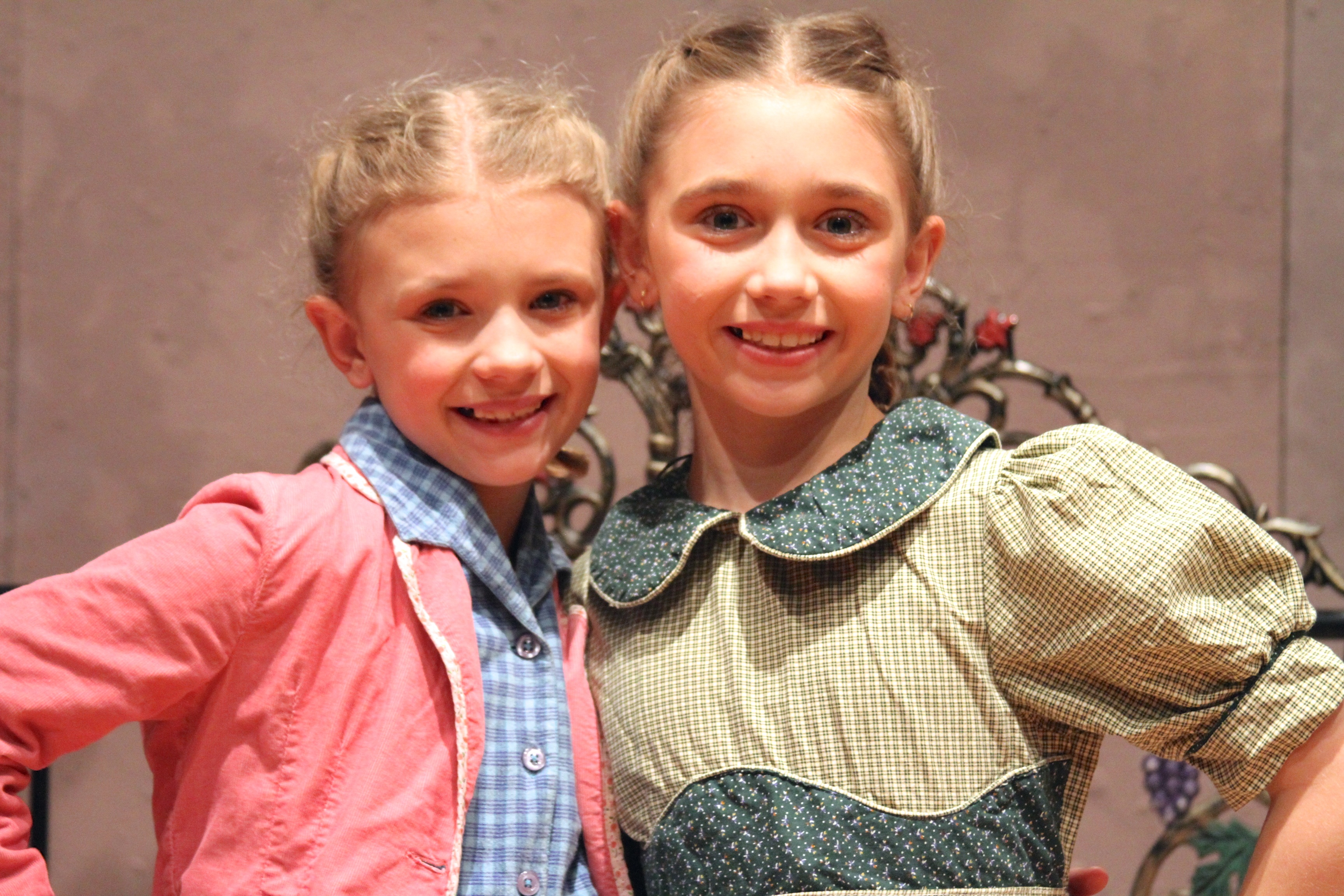 Lauren appearing as Brigitta in the Sound of Music with her sister Alexis as Marta