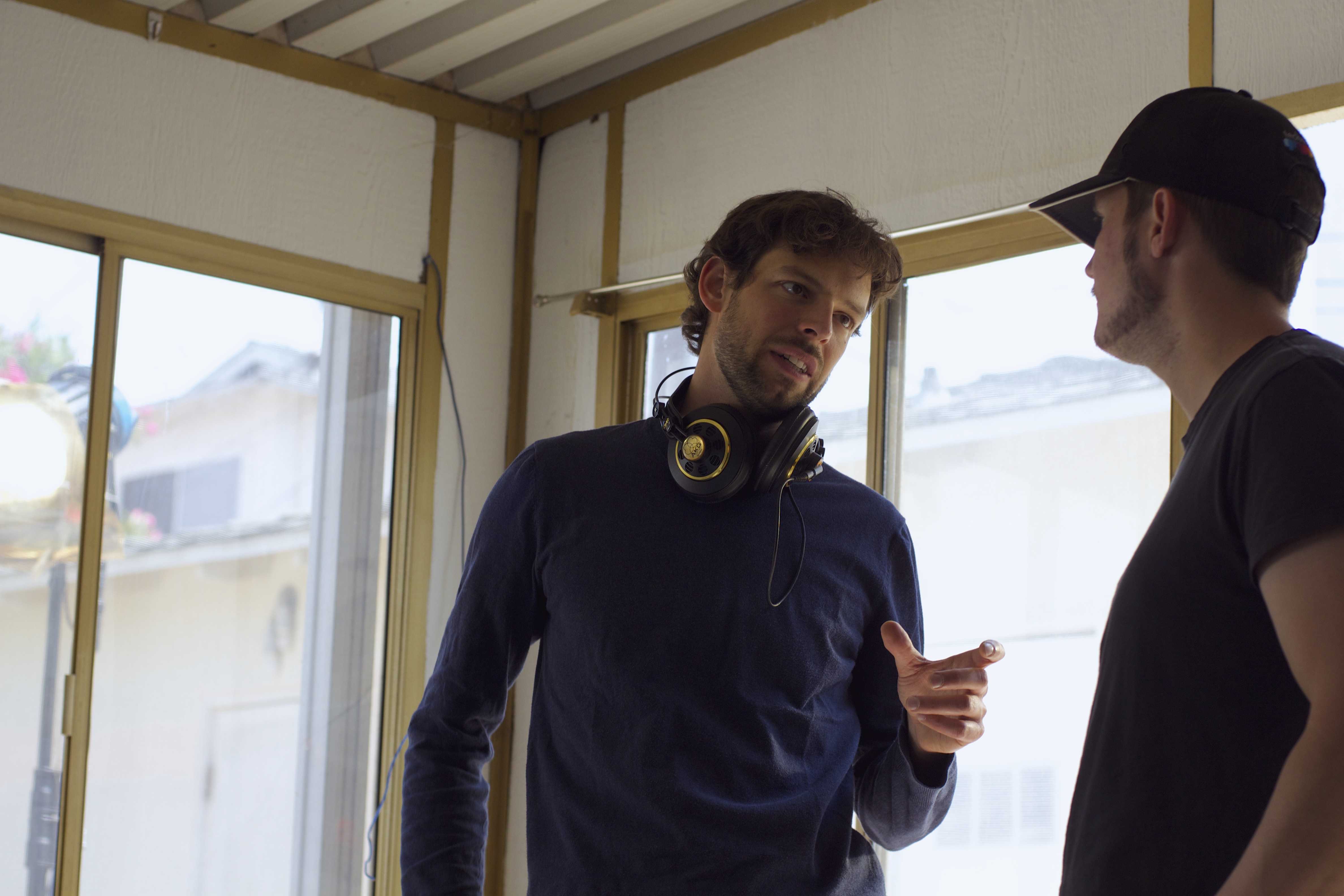 Andreas Graf discussing a scene with cinematographer Austin Nordell