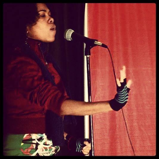 Shawntay Dalon performing at one of her SPOKEN WORD performances.