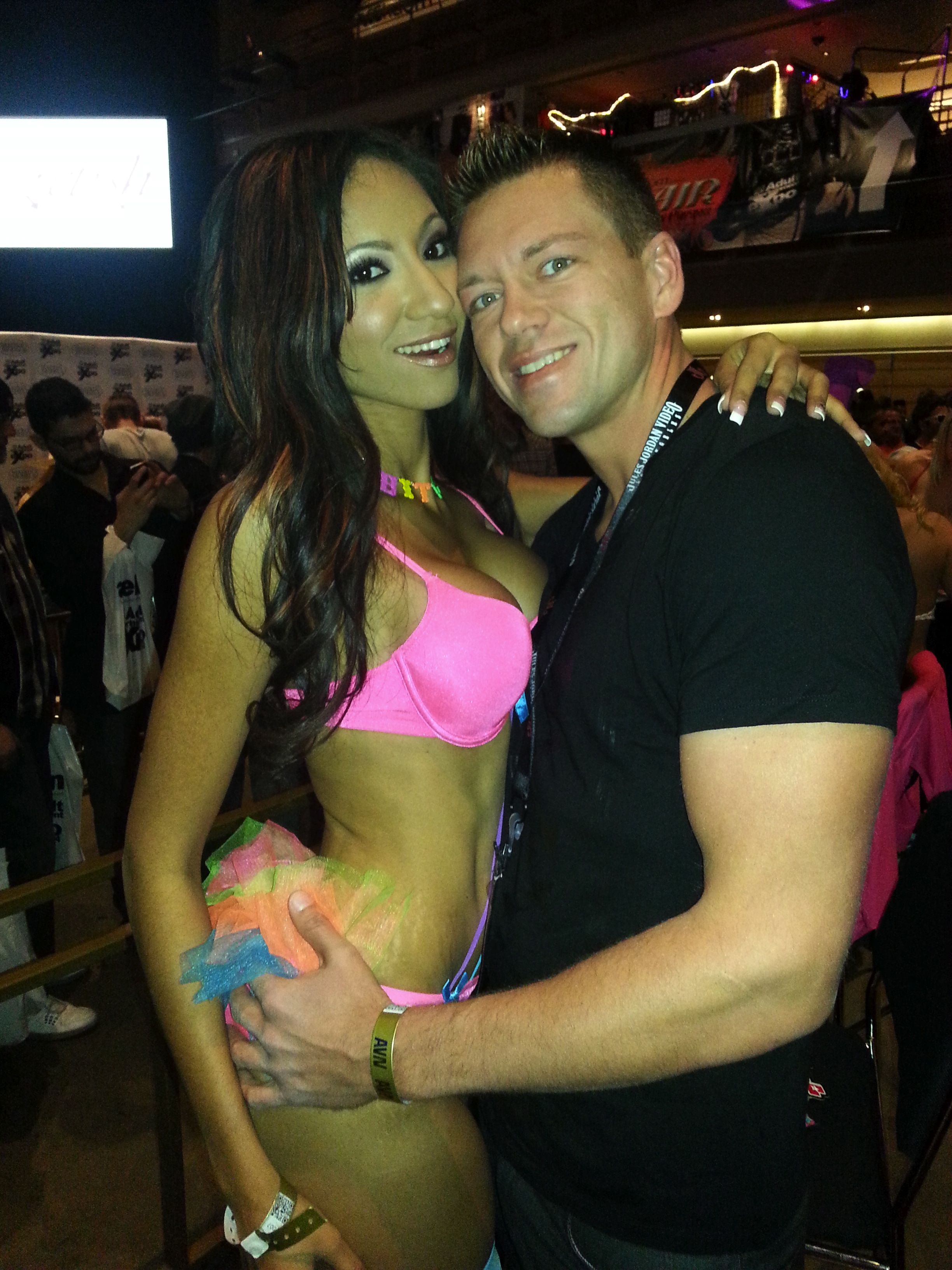 Sadie Santana and Jamie Stone attending the AVN Adult Entertainment Expo. They are pictured at the agency's booth.