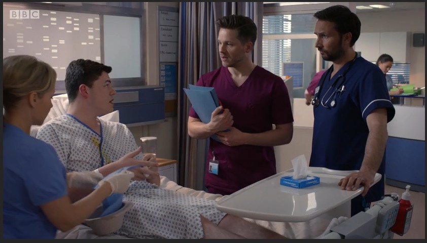 Max J Green as Stephen Holting in a scene with Alex Walkinshaw as Fletch, Kaye Wraggs as Essie and David Ames as Dom in Holby City. Episode Return to Innocence. S17 Ep 42 All time Episode Number 777