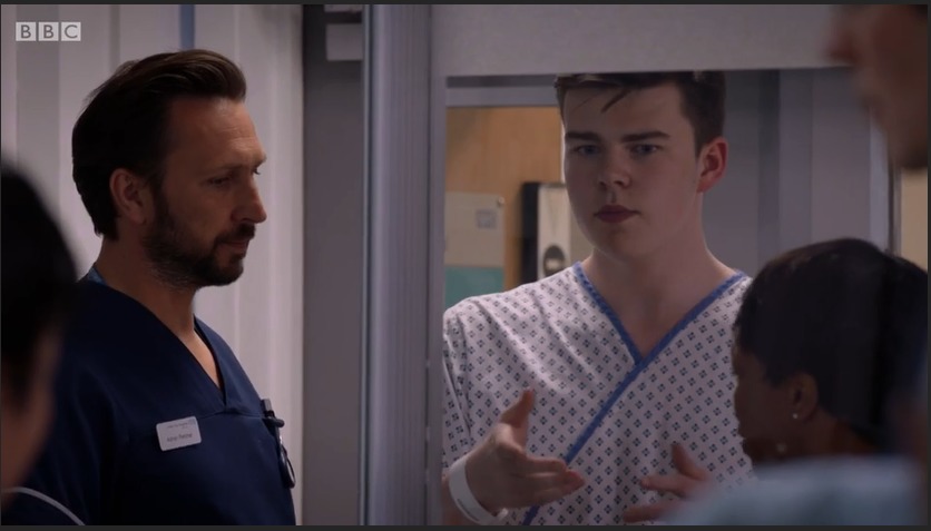 Max J Green as Stephen Holting in a scene with Angela Wynter as Ina Effanga and Alex Walkinshaw as Fletch in Holby City. Episode Title Return to Innocence S17 Ep 42 All time Episode number 777