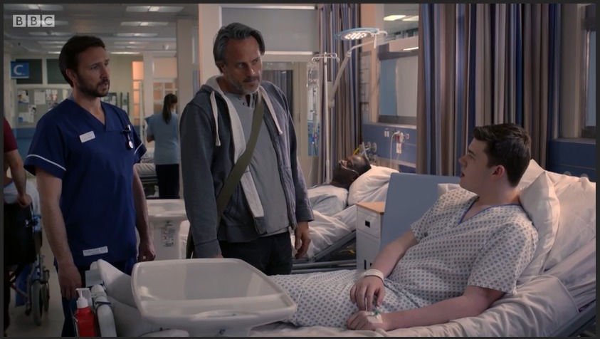 Max J Green as Stephen Holting in a scene with Alex Walkinshaw as Fletch and Mark Frost as Hugh Dogan in Holby City. Episode Title Return to Innocence S17 Ep 42 All time Episode Number 777