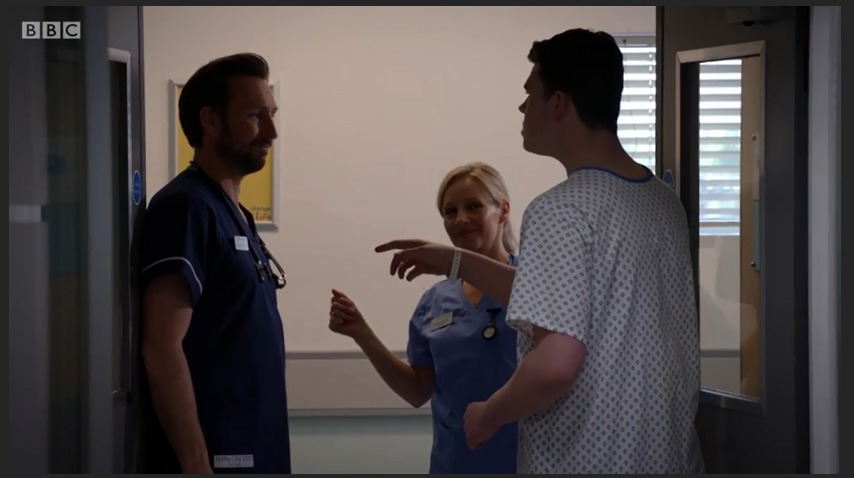 Max J Green as Stephen Holting in a scene with Alex Walkinshaw as Fletch and Kaye Wraggs as Essie in Holby City. Episode Title Return to Innocence S17 Ep 42 All time Episode Number 777
