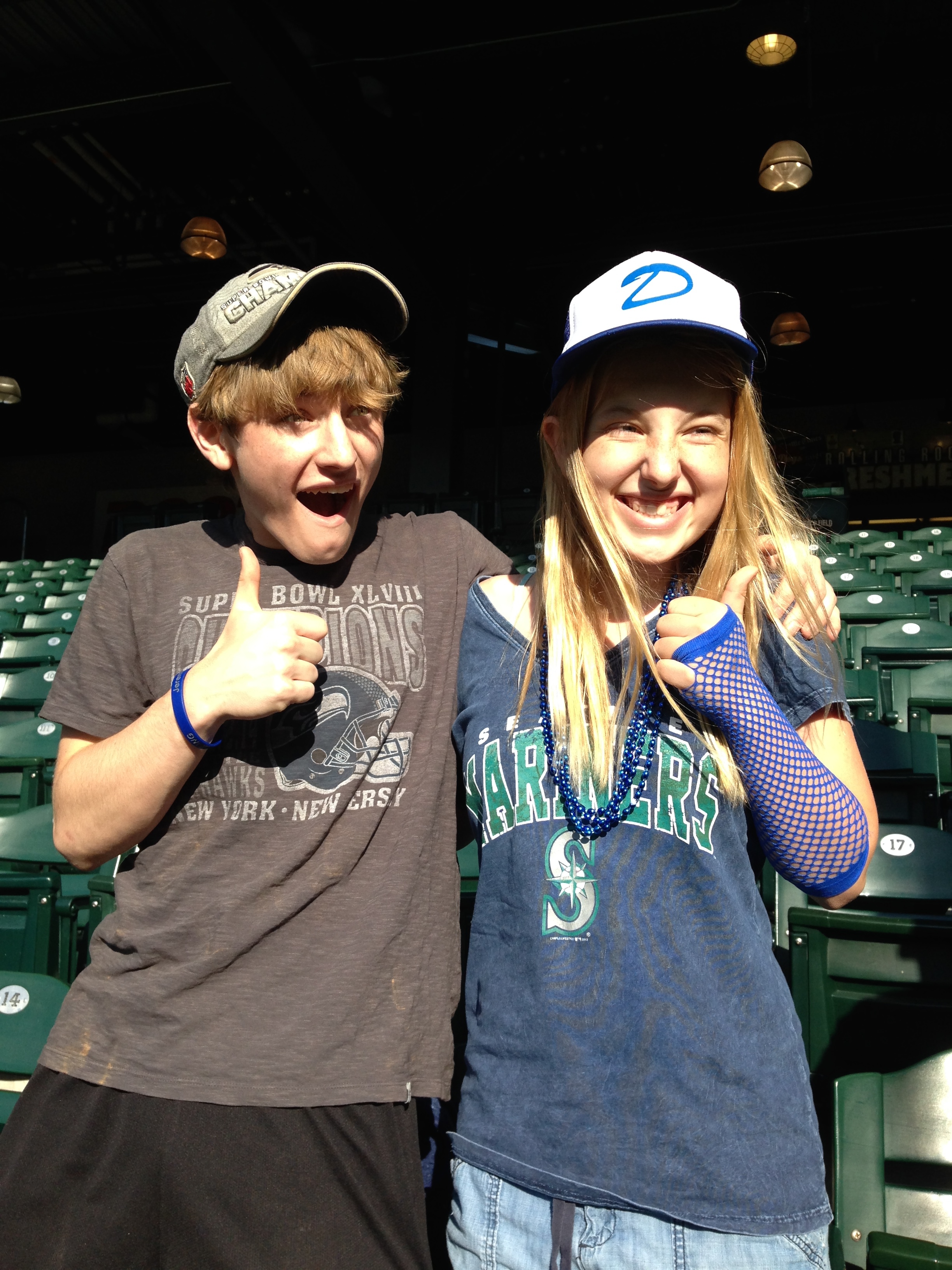 Laura with her big brother Nathan Gamble at a Mariners game.