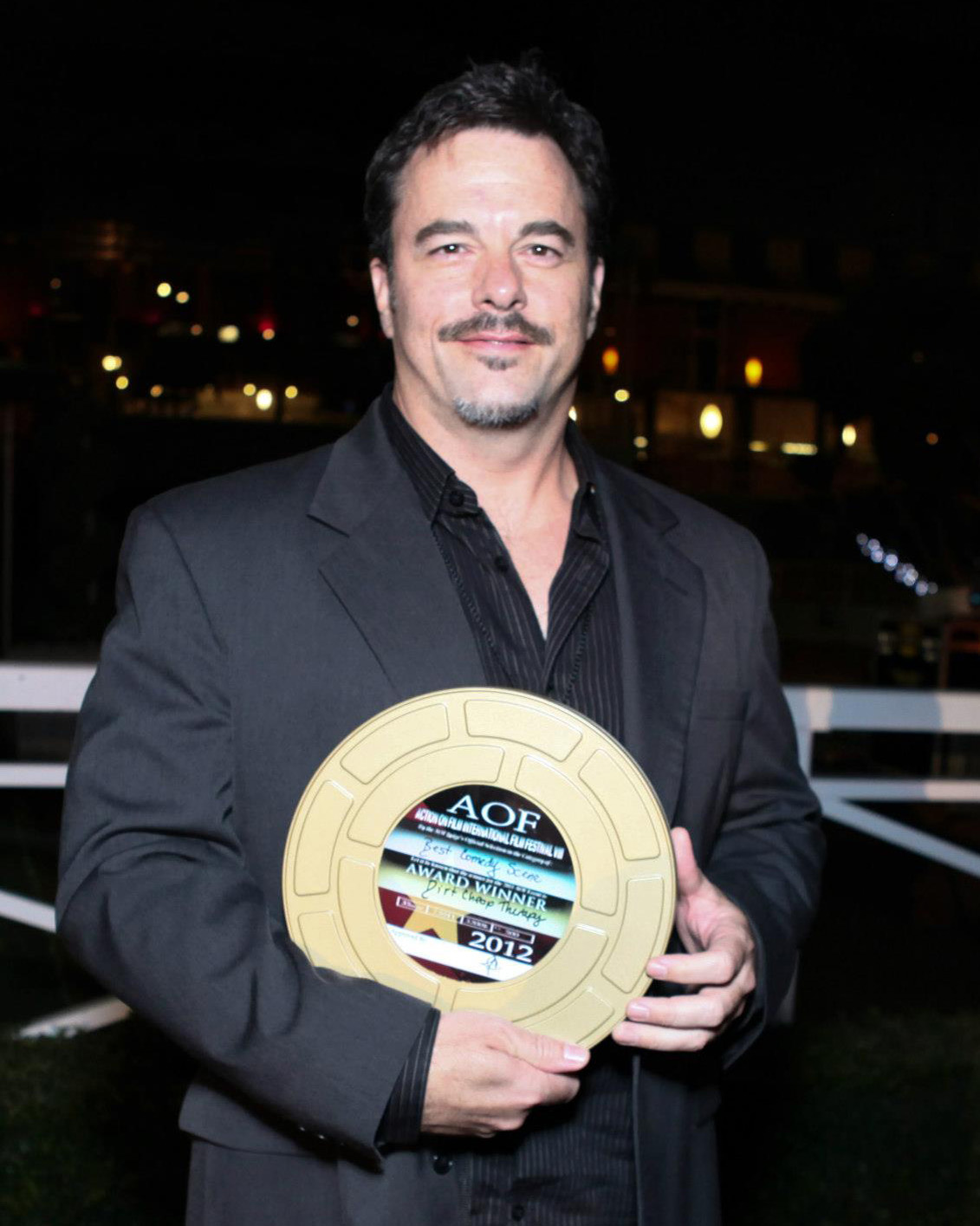 John Foutz at the Action on Film Awards Banquet at the Santa Anita Race Track with Award in hand.