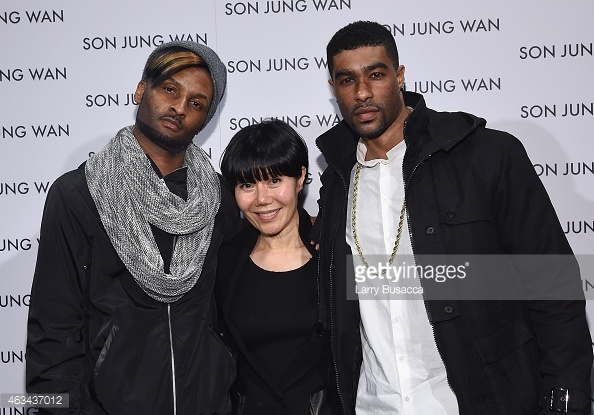 (L-R) Singer Chosen Wilkins, designer Son Jung Wan, and singer Alvester Martin pose backstage at the Son Jung Wan fashion show during Mercedes-Benz Fashion Week Fall 2015 at The Pavilion at Lincoln Center on February 14, 2015 in New York City