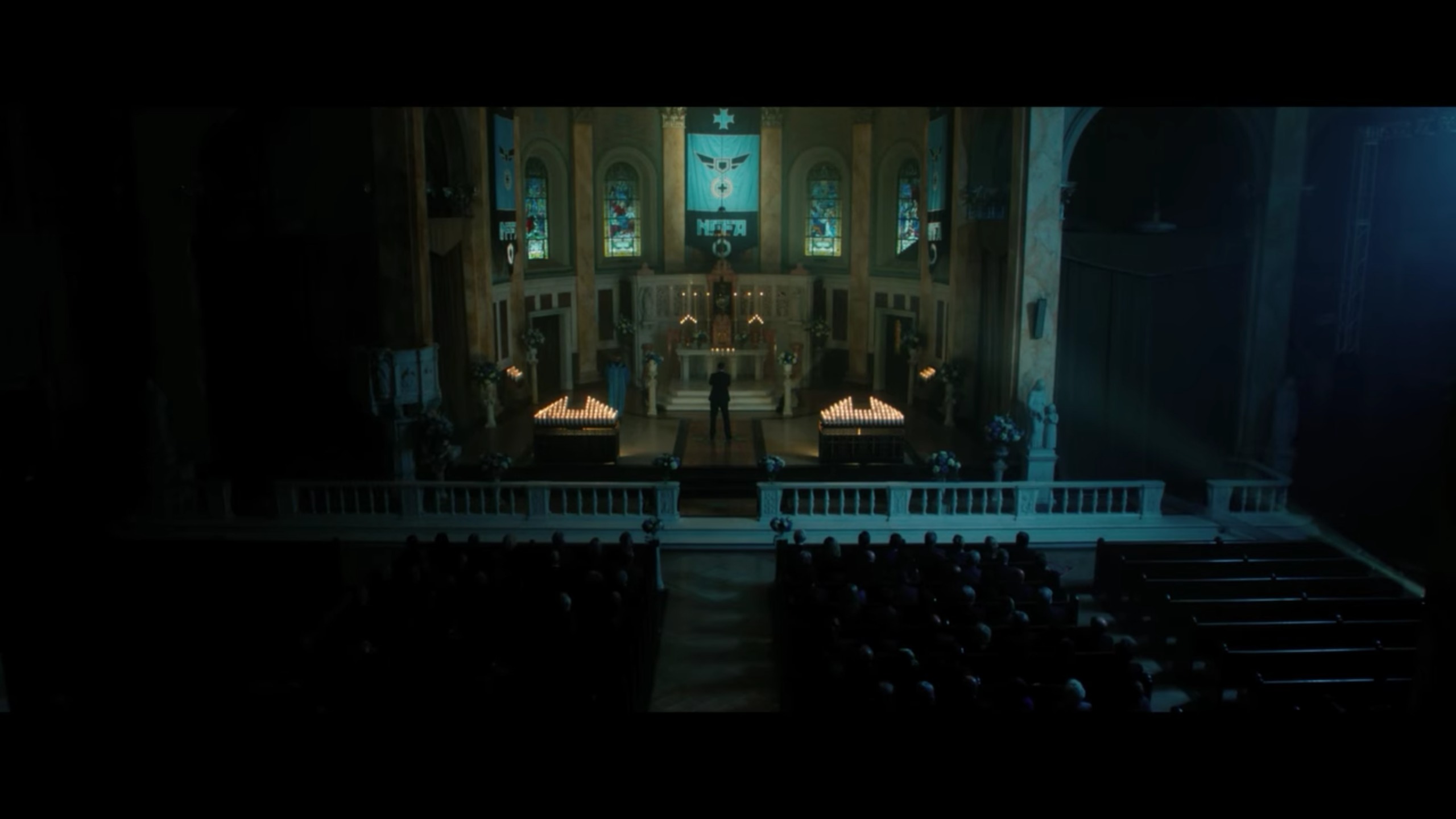 Still photo of Wayne Malm Jr. in the church scene of The Purge: Election Year