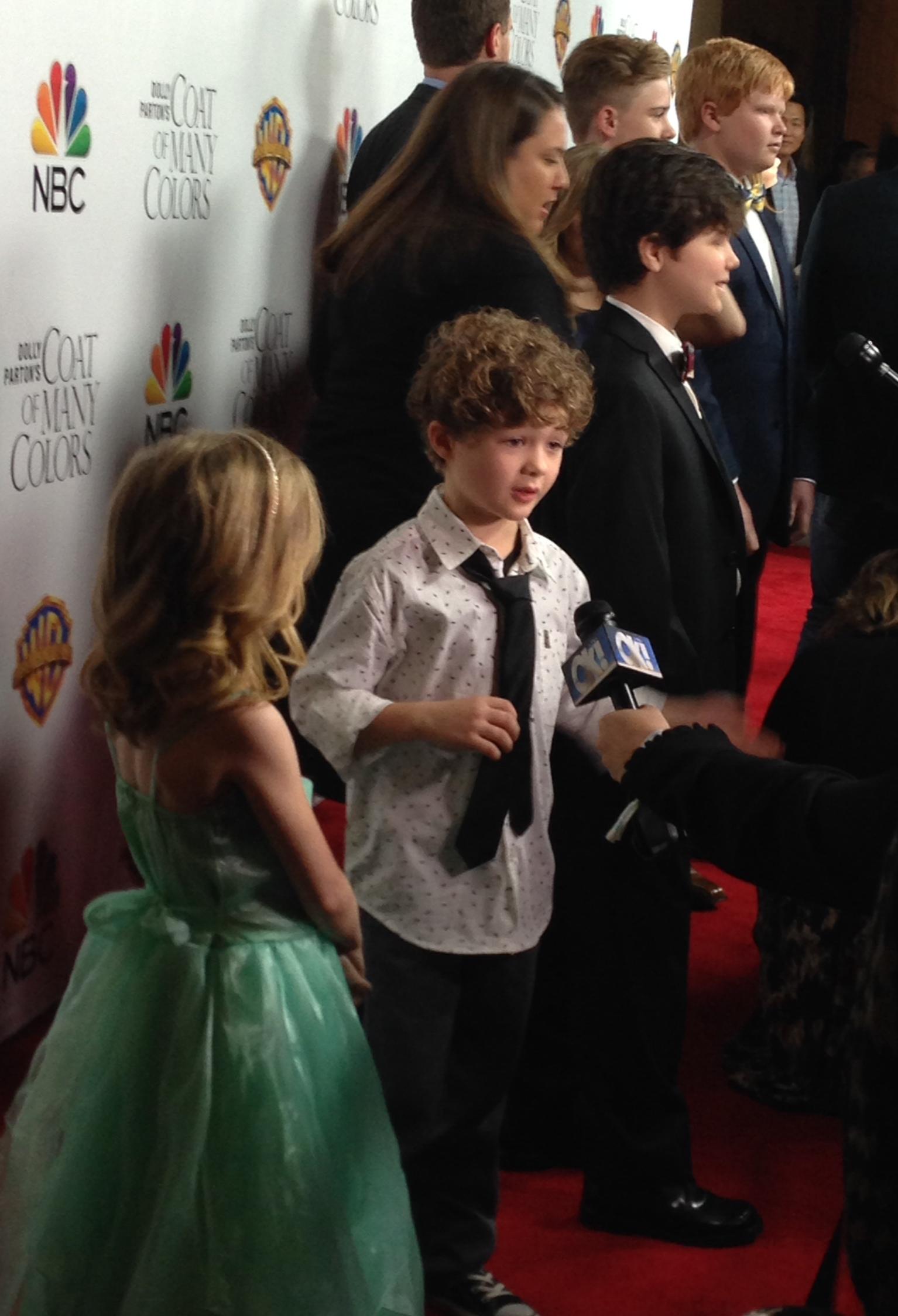 Coat of many colors red carpet. Blane as 