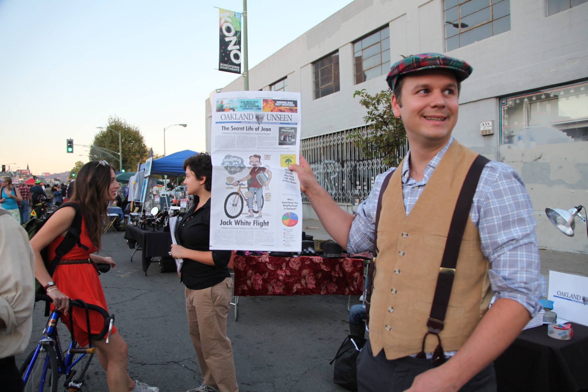 Matt Werner vending the Onion-style fake newspaper Oakland Unseen at Oakland's Art Murmur on October 4, 2013.