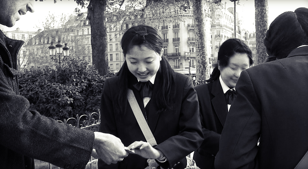 Performing magic on location in Paris.