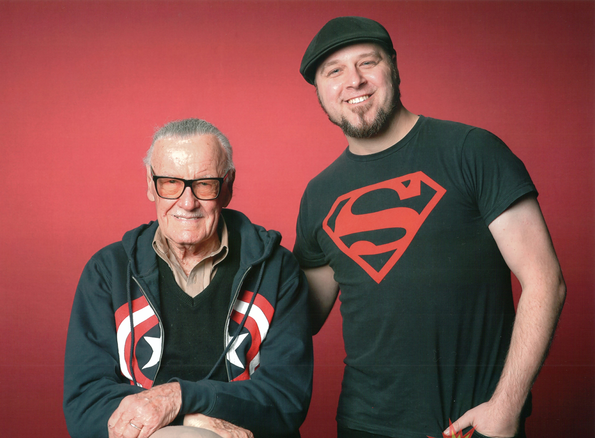 Tom Taylor and Stan Lee. While Taylor was writing Iron Man for Marvel comics.