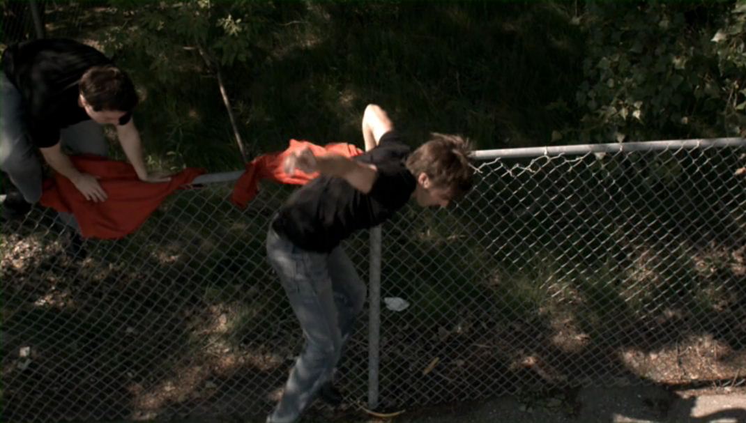 BRANDON LUDWIG jumping the fence to sneak on board an airplane